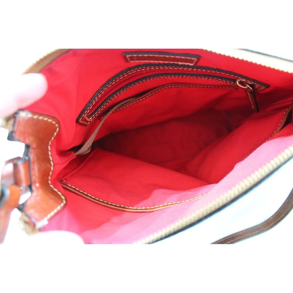 Dooney & Bourke Black Pebbled Leather Crossbody Bag with Tan Trim and Red Lining